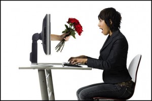 A woman siting in front of computer