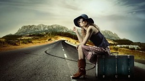 A woman sitting on luggage
