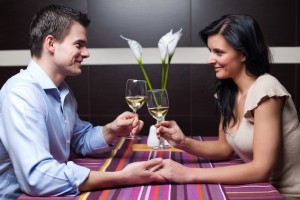 A couple sitting with wine