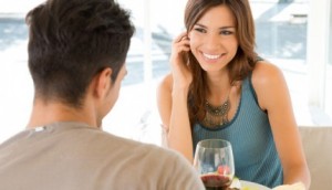 A smiling owman looking at a man