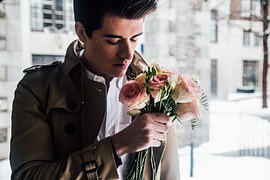  man holding roses